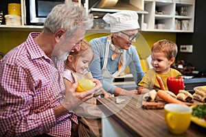 Children with grandparents having fun