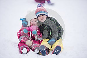Children group having fun and play together in fresh snow