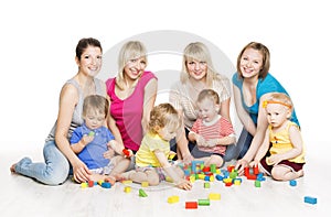 Children Group with Mothers Playing Toy Blocks. Little Kids Earl