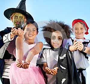 Children, group and portrait for halloween costume for sweet candy asking, trick or treat for fantasy. Friends, hands or