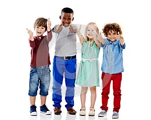 Children, group and together for thumbs up in studio portrait with smile, agreement and white background. Girl, boy or