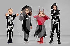 children in halloween costumes trick-or-treating