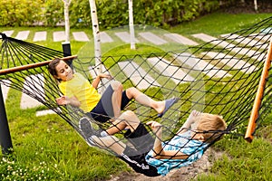 children in a hammock. Happy family holiday.