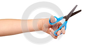 Children hand with blue little scissors, kids educational work