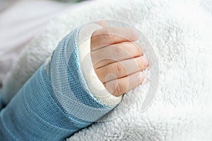 Children hand bone broken with arm splint