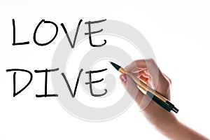 Children hand with pen write on an blue white background. Writing hand. Word Love Dive