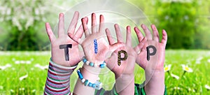 Children Hands Building Word Tipp Means Tip, Grass Meadow photo