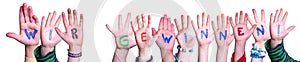 Children Hands Building Word Wir Gewinnen Means Winning. White Background photo