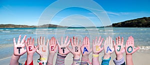 Children Hands Building Word Teletrabajo Means Teleworking, Ocean And Sea photo