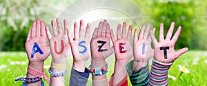 Children Hands Building Word Auszeit Means Downtime, Grass Meadow photo