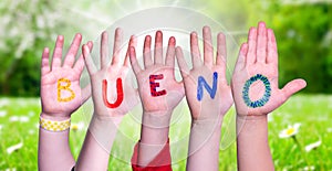Children Hands Building Word Bueno Means Good, Grass Meadow photo