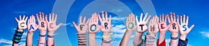 Children Hands Building Word Care For Others, Blue Sky photo