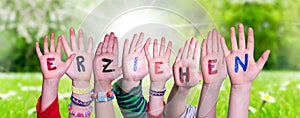 Children Hands Building Word Erziehen Means Educate, Grass Meadow