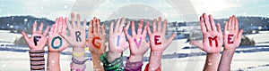 Children Hands Building Word Forgive Me, Snowy Winter Background