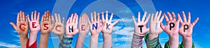 Children Hands Building Word Geschenk Tipp Means Gift Tip, Blue Sky photo