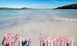 Children Hands Building Word Herzlich Willkommen Mean Welcome, Ocean Background