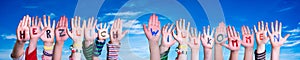 Children Hands Building Word Herzlich Willkommen Means Welcome, Blue Sky