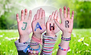 Children Hands Building Word Jahr Means Year, Grass Meadow