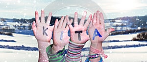 Children Hands Building Word KITA Means Kindergarden, Snowy Winter Background