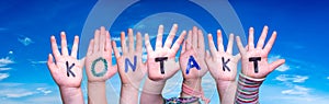 Children Hands Building Word Kontakt Means Contact, Blue Sky