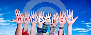 Children Hands Building Word Menschen Means Human, Blue Sky