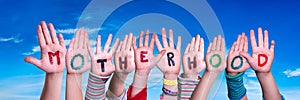 Children Hands Building Word Motherhood, Blue Sky