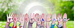 Children Hands Building Word Teletrabajo Means Teleworking, Grass Meadow photo