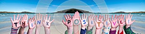 Children Hands Building Word Think Positive, Ocean Background