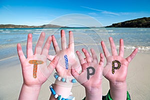 Children Hands Building Word Tipp Means Tip, Ocean Background photo