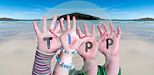 Children Hands Building Word Tipp Means Tip, Ocean Background photo