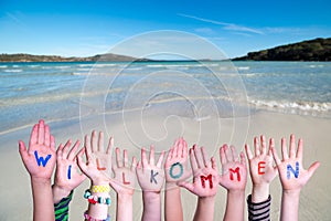 Children Hands Building Word Willkommen Means Welcome, Ocean Background