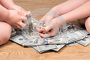 Children hands crumple dollars