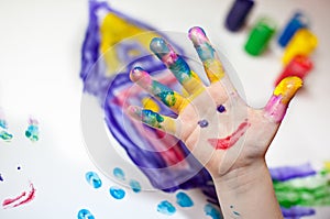 Children Hands doing Fingerpainting photo