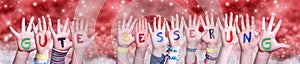 Children Hands Gute Besserung Means Get Well, Red Christmas Background