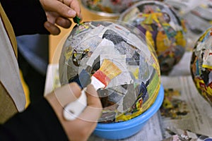 Children hands are making a bowl.