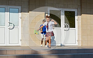 Children happily run from school after the end of lessons