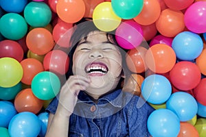 Children happiness emotion in colorful on ball pool