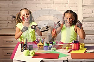 Children happy smiling with colored hands