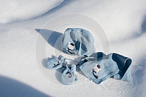 Children hat, scarf and gloves on the snow