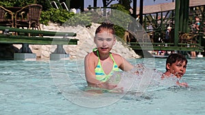 Children have fun in a swimming pool