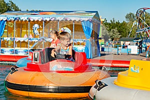 Children have fun on a water attraction in an extreme recreation park