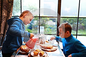Children have lunch in restaurant
