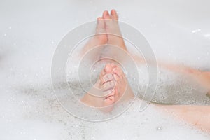 Children having a bubble bath. Selective focus