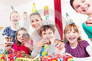 Children having cupcakes celebrating birthday