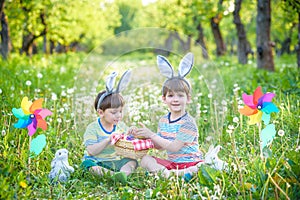 Children having fun and playing with easter eggs.