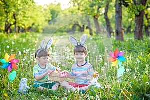 Children having fun and playing with easter eggs.