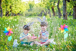 Children having fun and playing with easter eggs.
