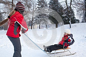 Children having fun in winter park