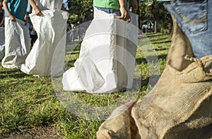 Children having a sack race in the park