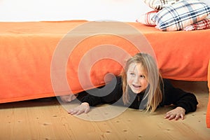 Children hiding under bed